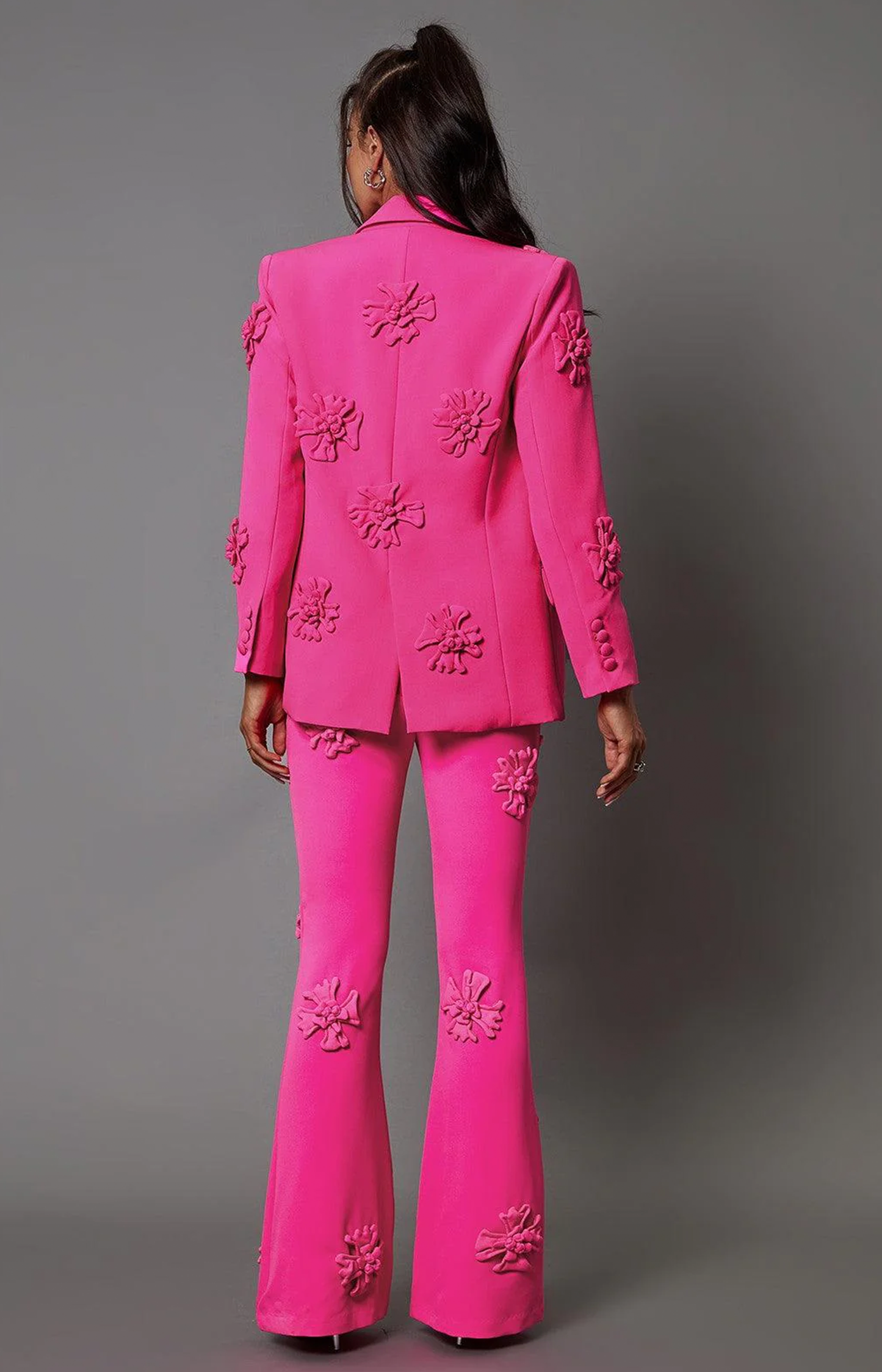 Pink women's suit blazer with floral embellishment