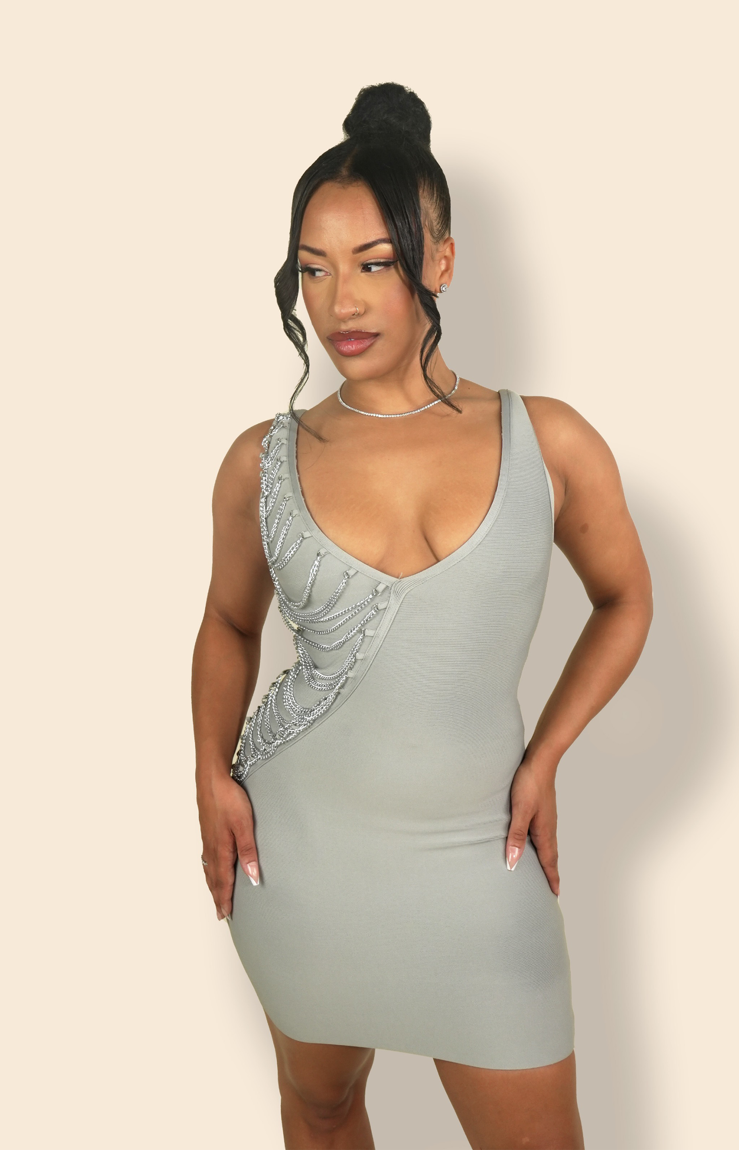Grey bandage bodycon mini dress with V neckline and embellished chain